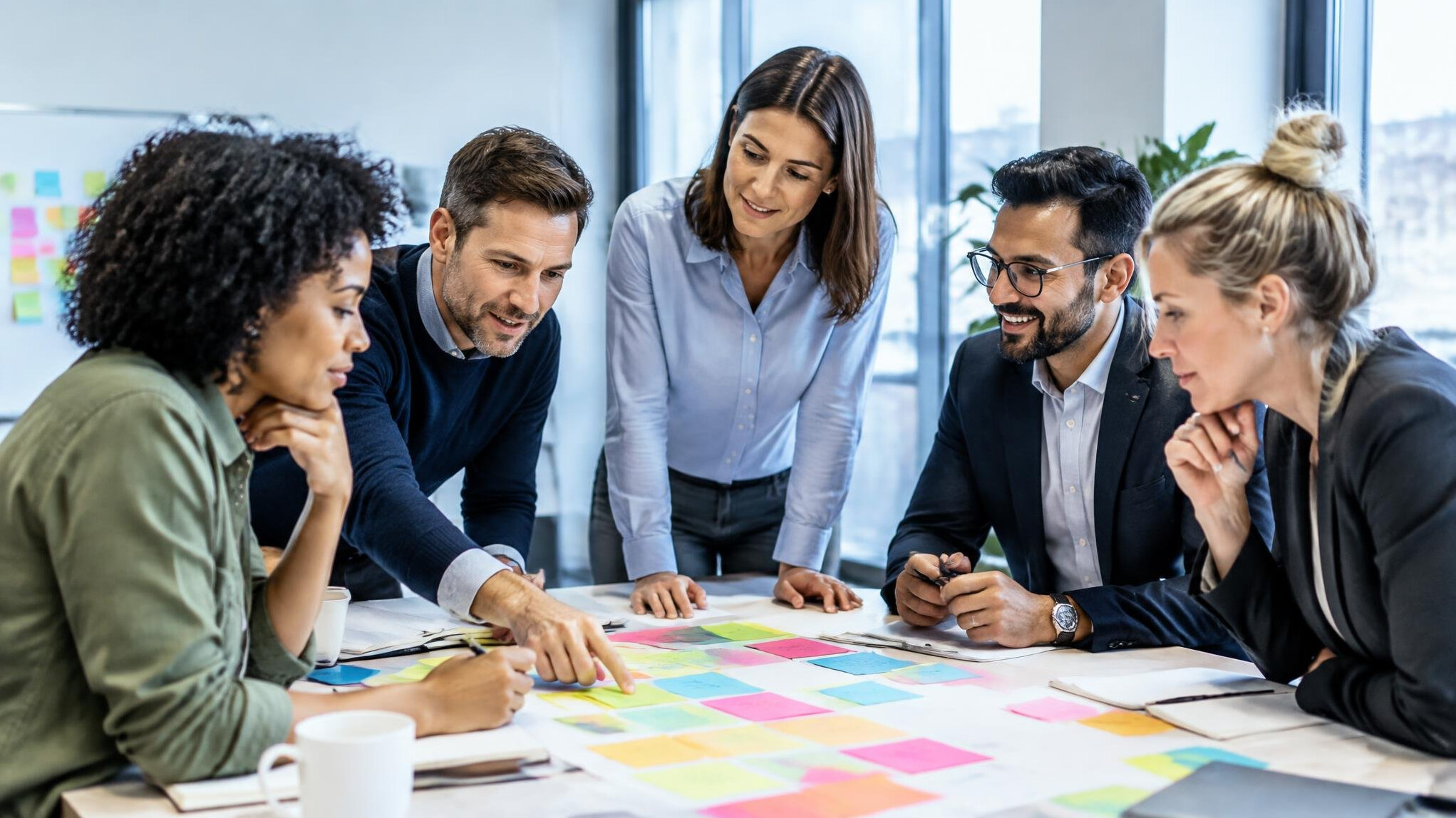 Collaborative workshop with colorful sticky notes on a table